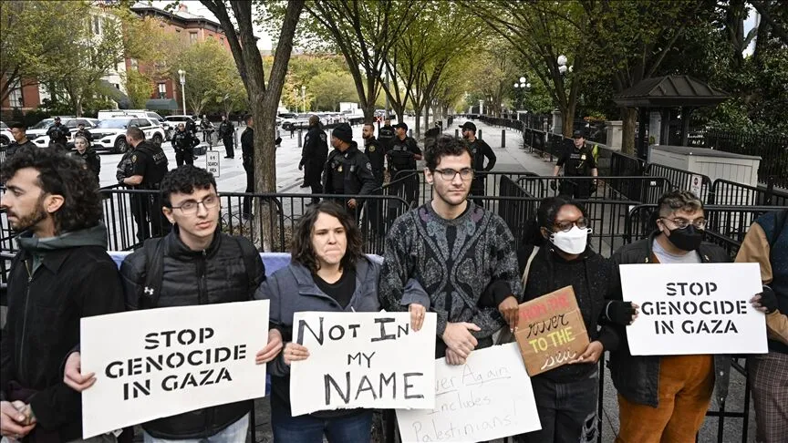 On October 17, 2023, anti-Zionist Jews and pro-Palestinian activists protest outside of the White House with signs saying “Stop Genocide in Gaza.”